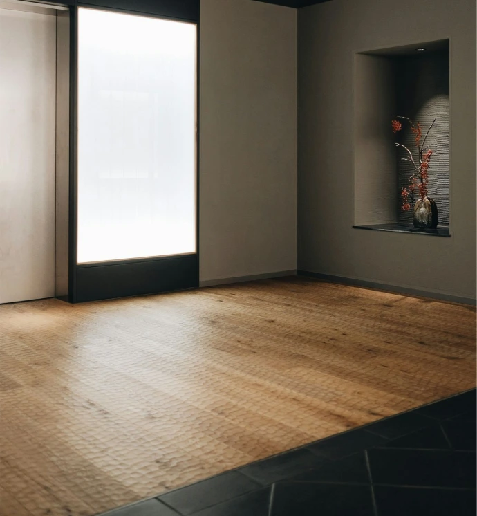 brown wooden floor and white walls